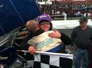 Bethany Stoehr is hugged by her father Greg after winning Sunday's NEMA Midget feature Sunday at the Waterford Speedbowl